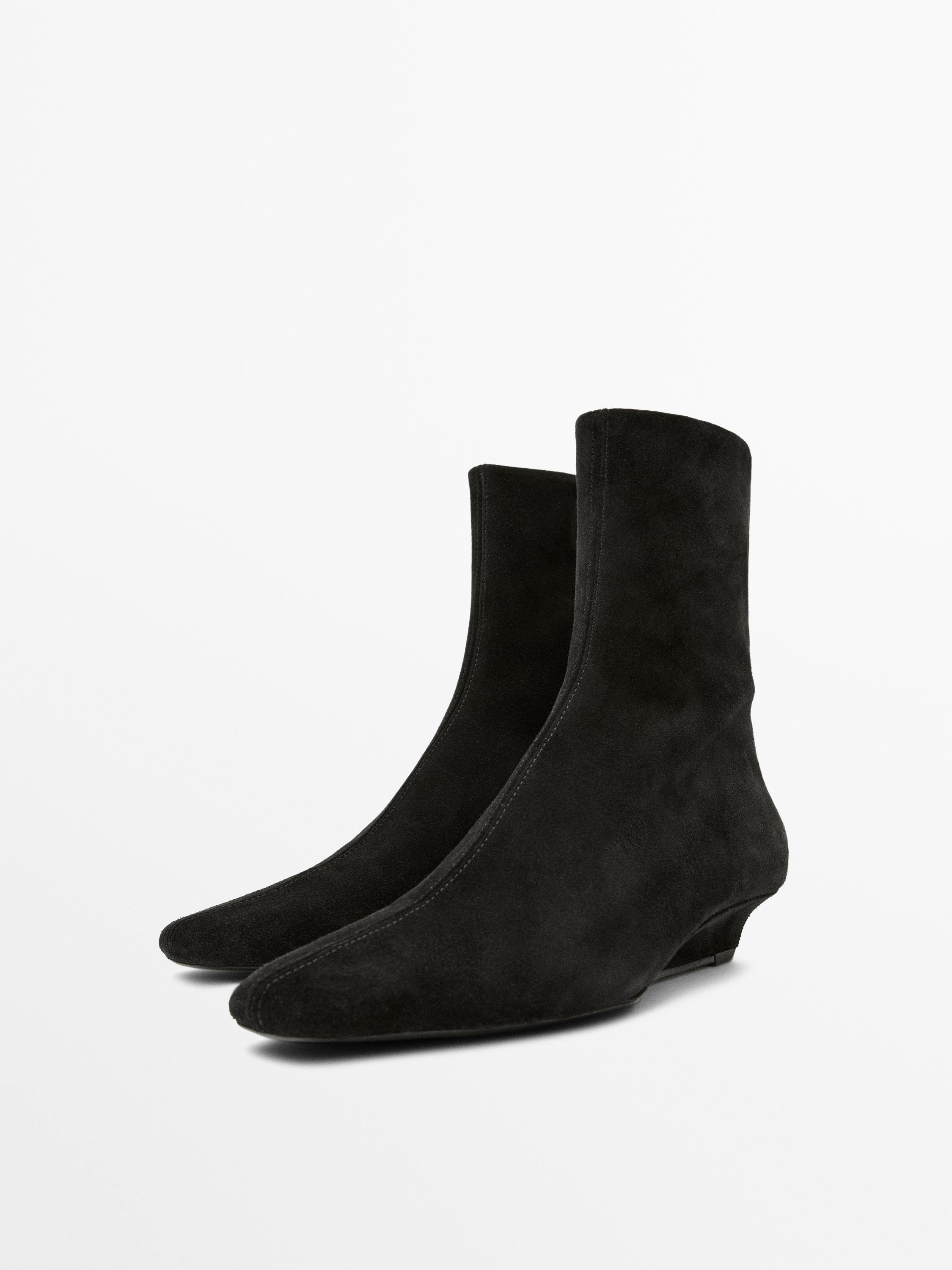 Bottines compensées en croûte de cuir